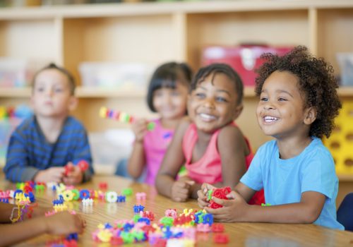 A diverse group of preschoolers in a classroom